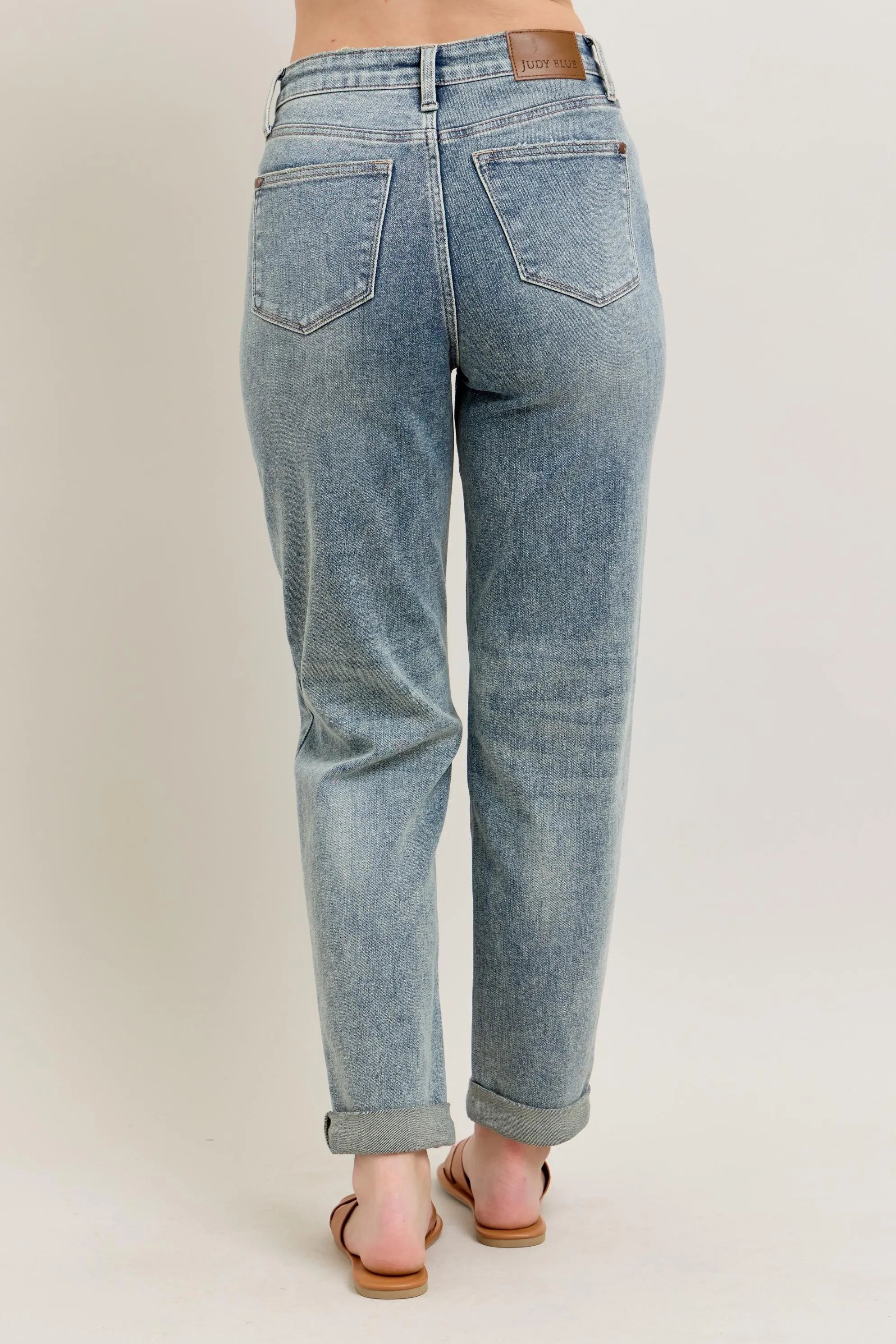Light blue vintage-wash jeans with back yoke seams and double roll cuff