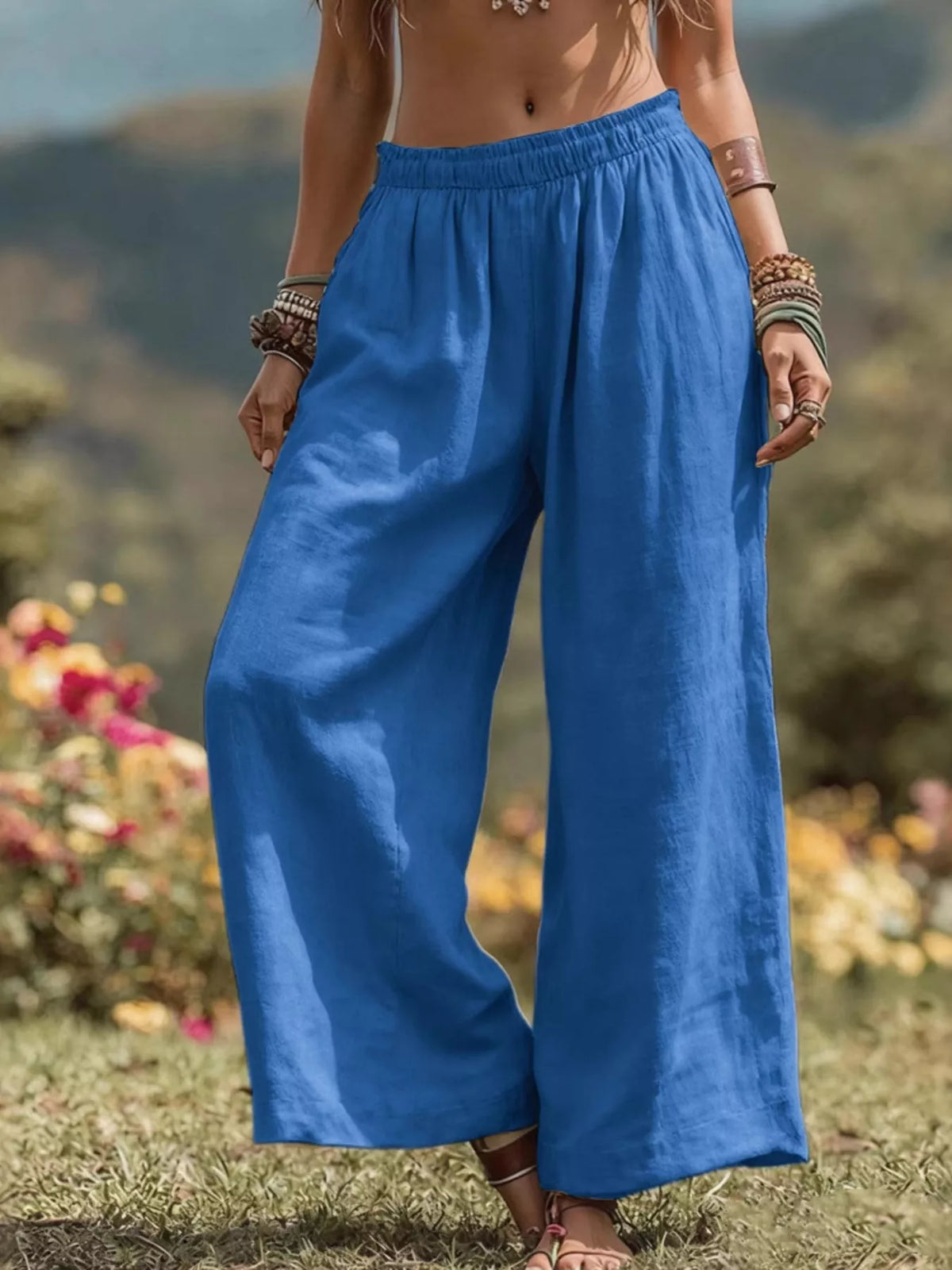 Blue bohemian wide-leg pants with elastic waistband and relaxed, flowy legs