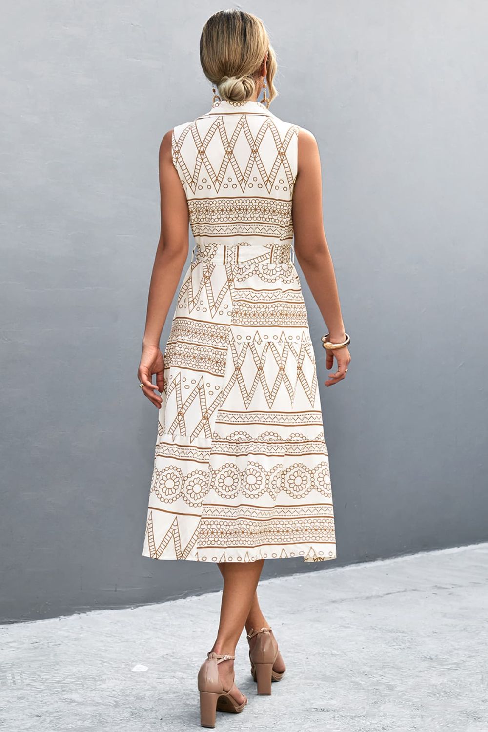 White printed sleeveless collared dress, back view with tie waist