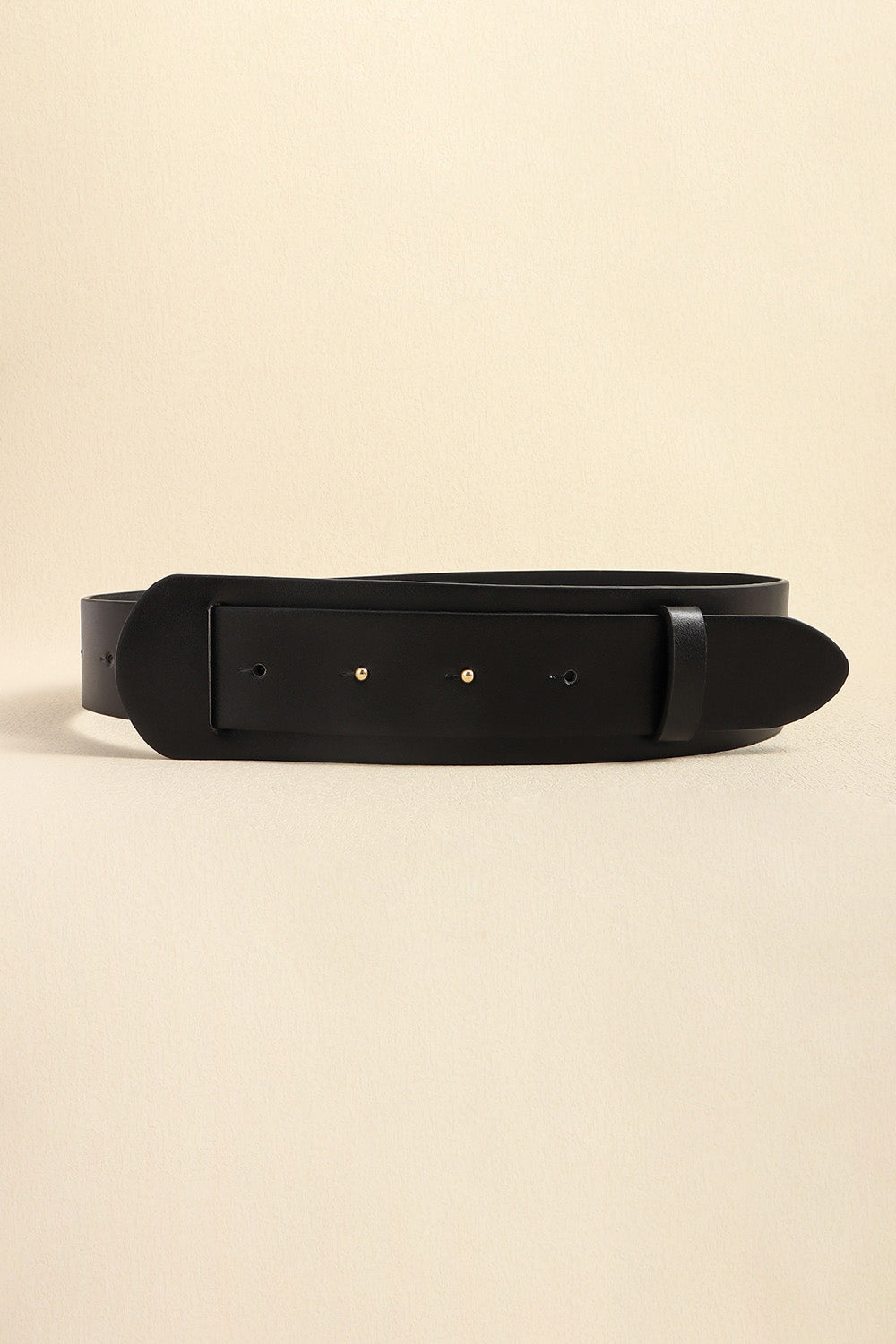 Vegan leather belt in black, centered rectangular buckle plate with small metal rivets