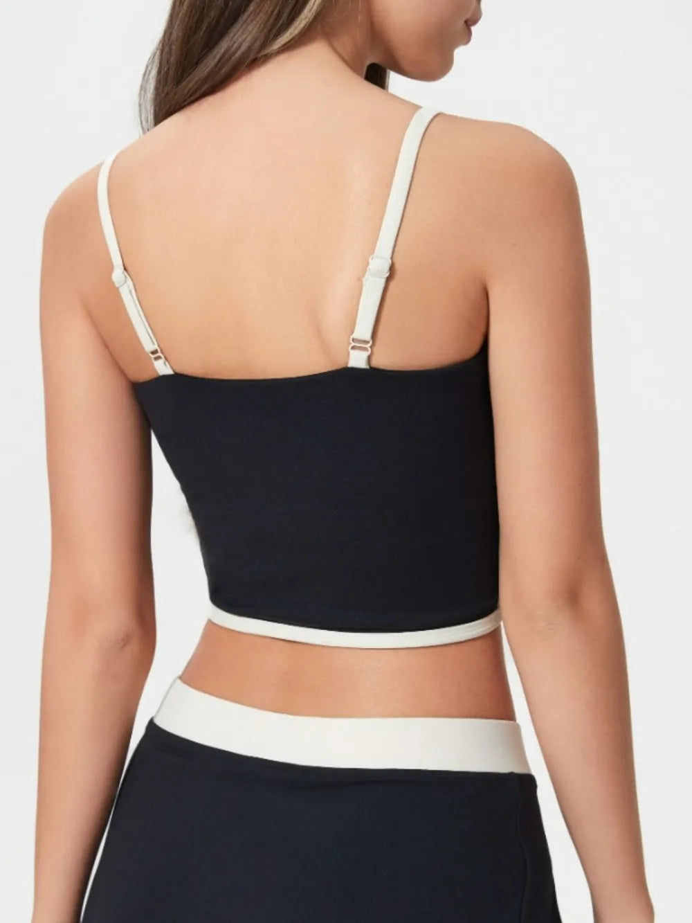 Back view of black active cami with contrast white trim and wide adjustable straps