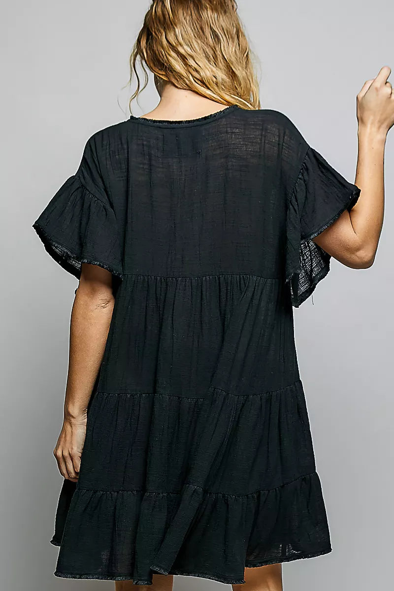 Black cotton tiered ruffle short-sleeve dress, back view