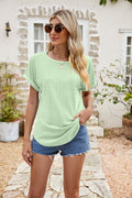 Light green round neck eyelet short sleeve top with vertical textured front detail