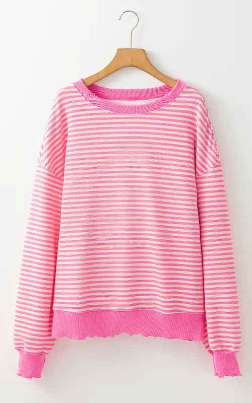 Pink striped long-sleeve sweatshirt on hanger, round neckline and ribbed hem