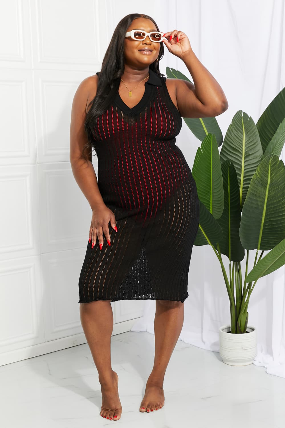 Black knit cover-up dress with V-neck and red vertical openwork stripes, sleeveless midi