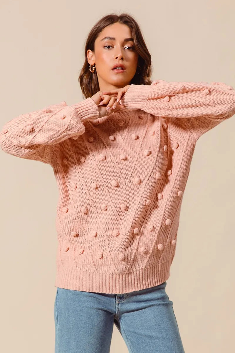 Blush textured knit crewneck sweater with raised pom-pom dots and long sleeves