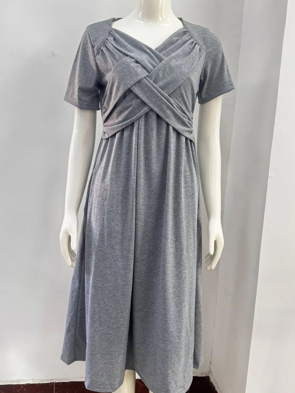 Gray V-neck crisscross high-waist midi dress on mannequin, short sleeves