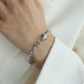 Silver snake-head chain bracelet with textured link detail