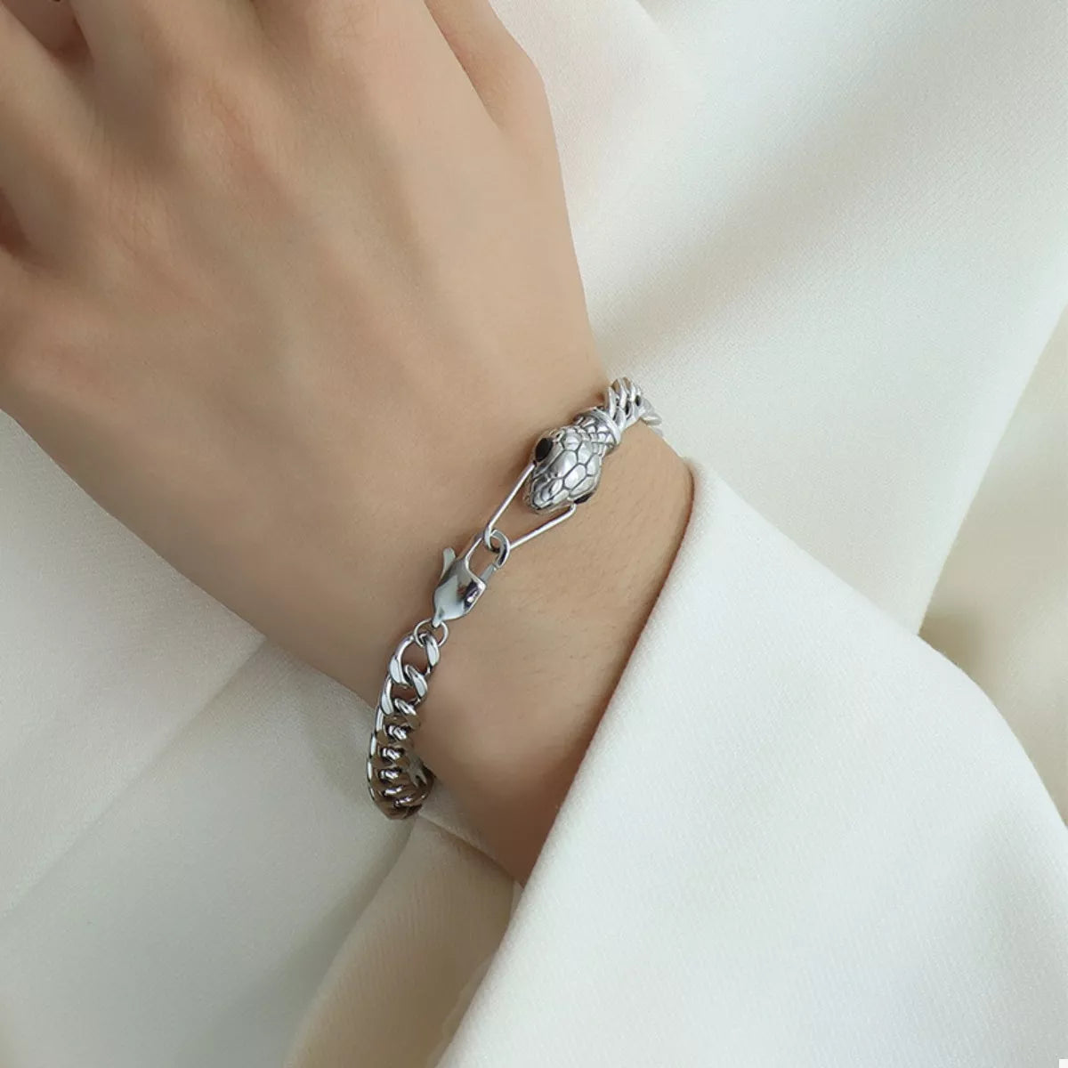 Silver snake-head chain bracelet with textured link detail