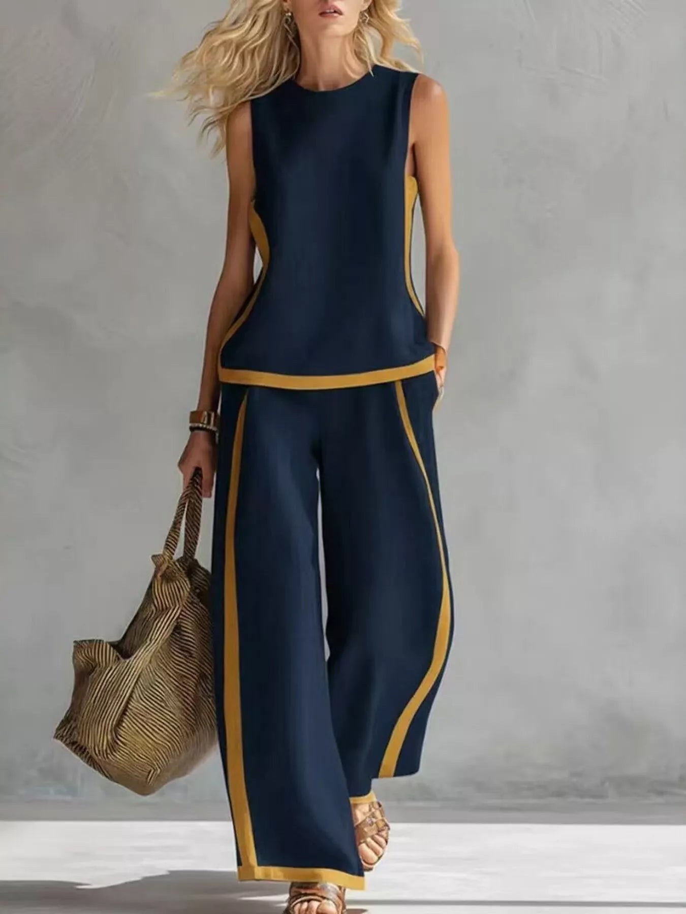 Navy blue sleeveless top and wide-leg pants set with gold contrast trim