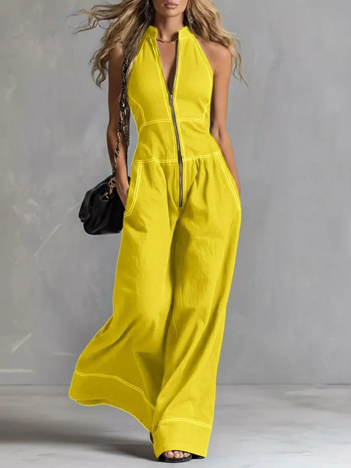 Zip-front sleeveless wide-leg jumpsuit, bright yellow with front zipper and seam detailing