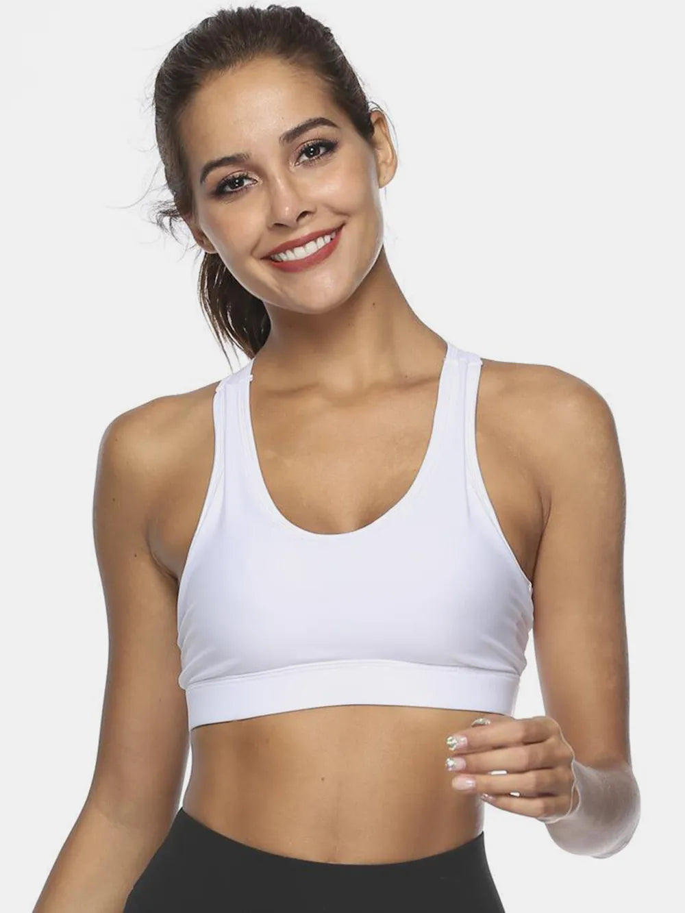 White scoop neck active tank with racerback; fitted cropped sports bra style