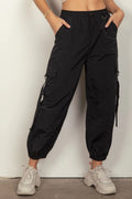 Black elastic-waist cargo pants with jogger cuffs and side cargo pockets