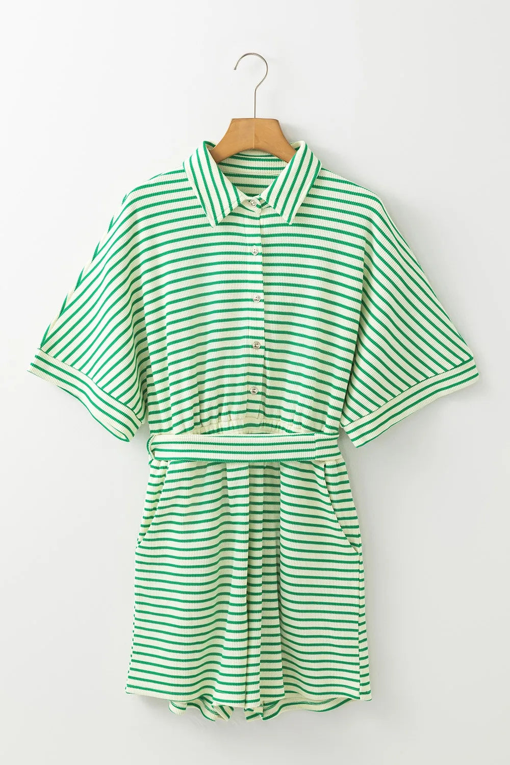 Green and white striped romper on hanger, half sleeves and tie-waist waist belt
