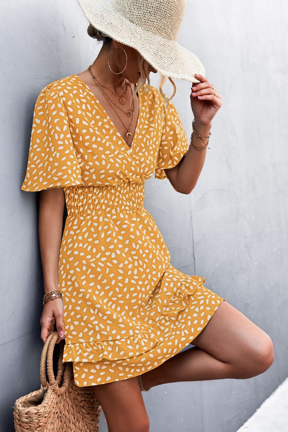 Mustard printed surplice dress with smocked waist and layered skirt, short flutter sleeves