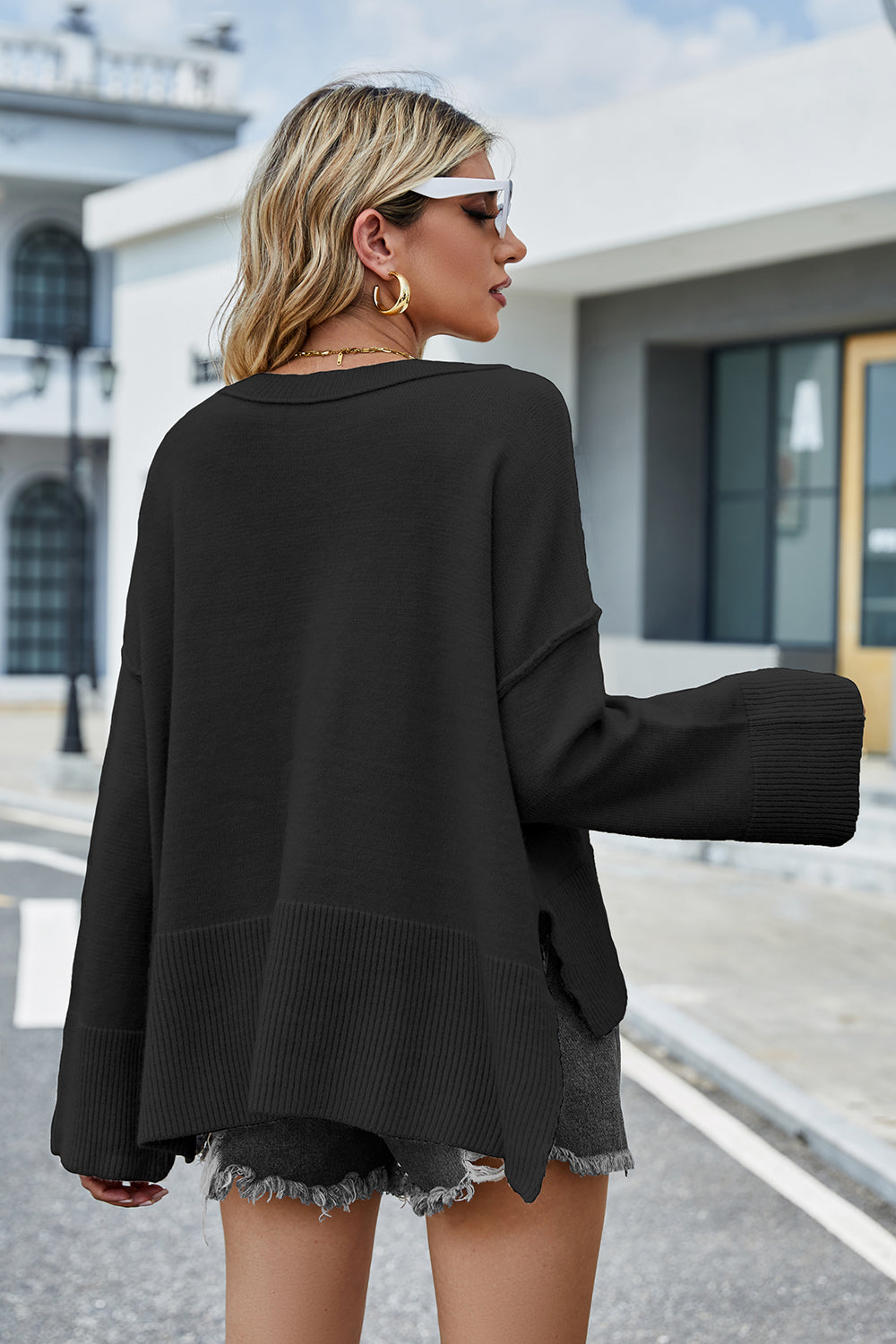 Black dropped-shoulder sweater back with ribbed hem and cuffed sleeves