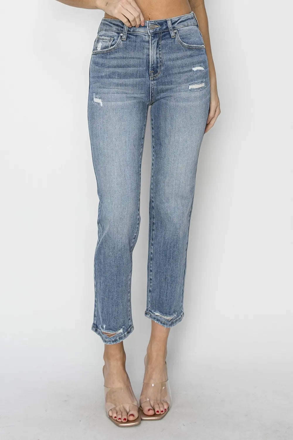 High-waist medium-wash cropped jeans with light whiskering and frayed cuffs.