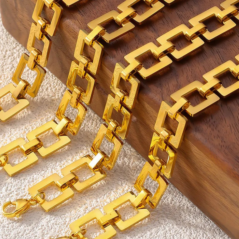 Gold hollow square link chain bracelet with small dangling end links