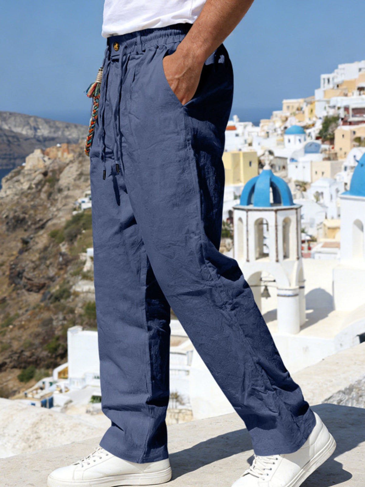 Navy drawstring pants with side pockets and relaxed straight legs