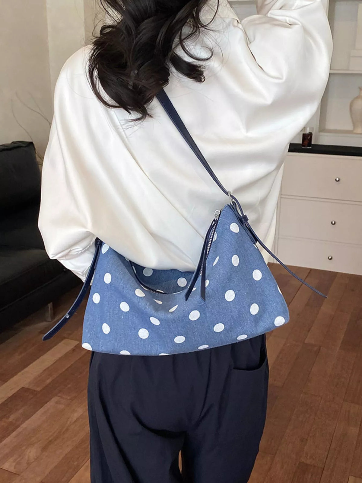 Blue polka dot small shoulder bag with zipper opening and long shoulder strap
