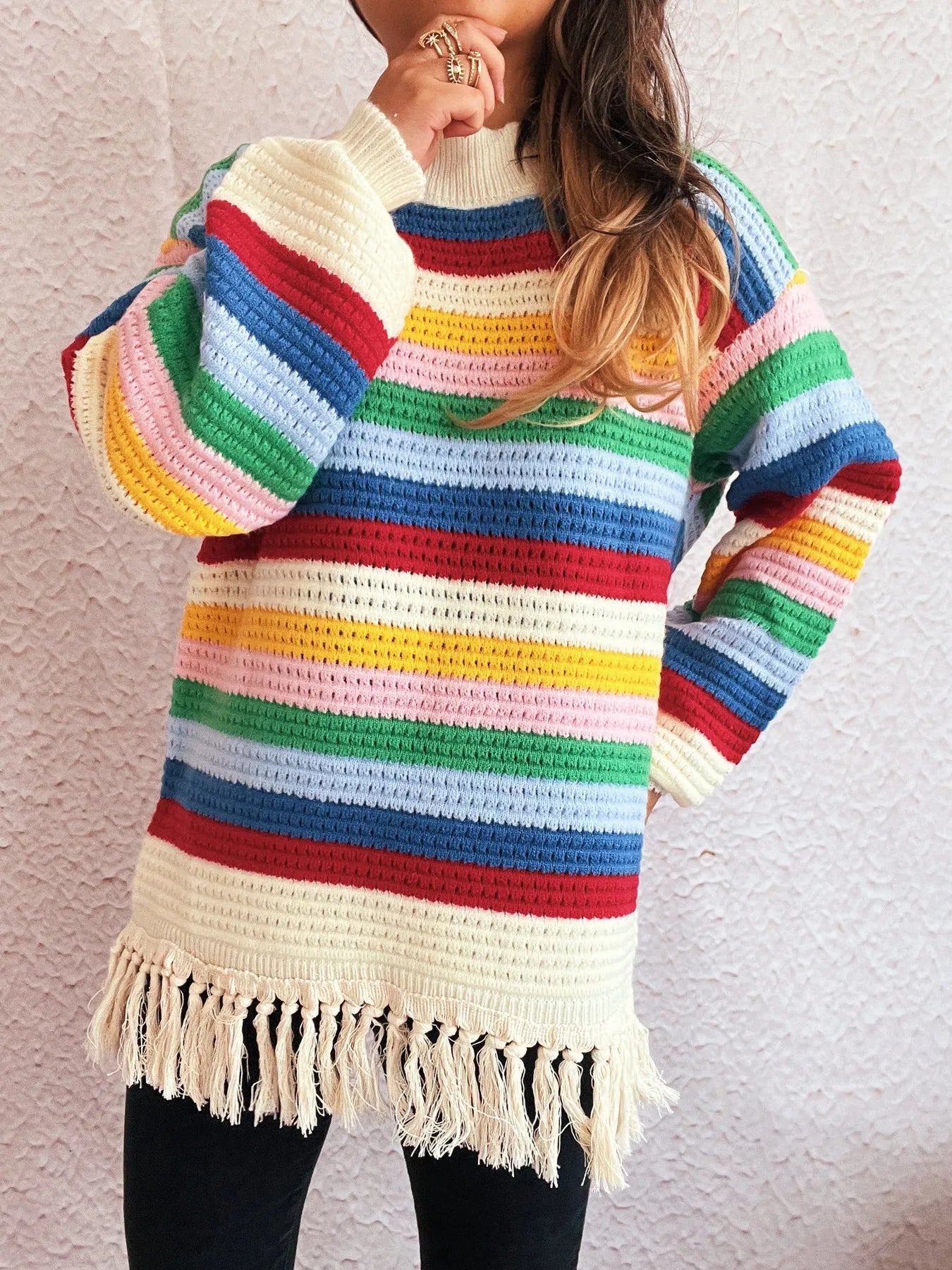 Rainbow striped long sleeve sweater with cream collar and tassel fringe hem