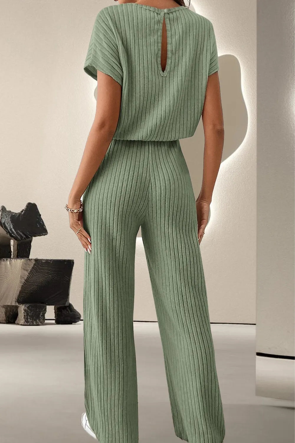 Sage ribbed knit jumpsuit with open-back keyhole and wide legs