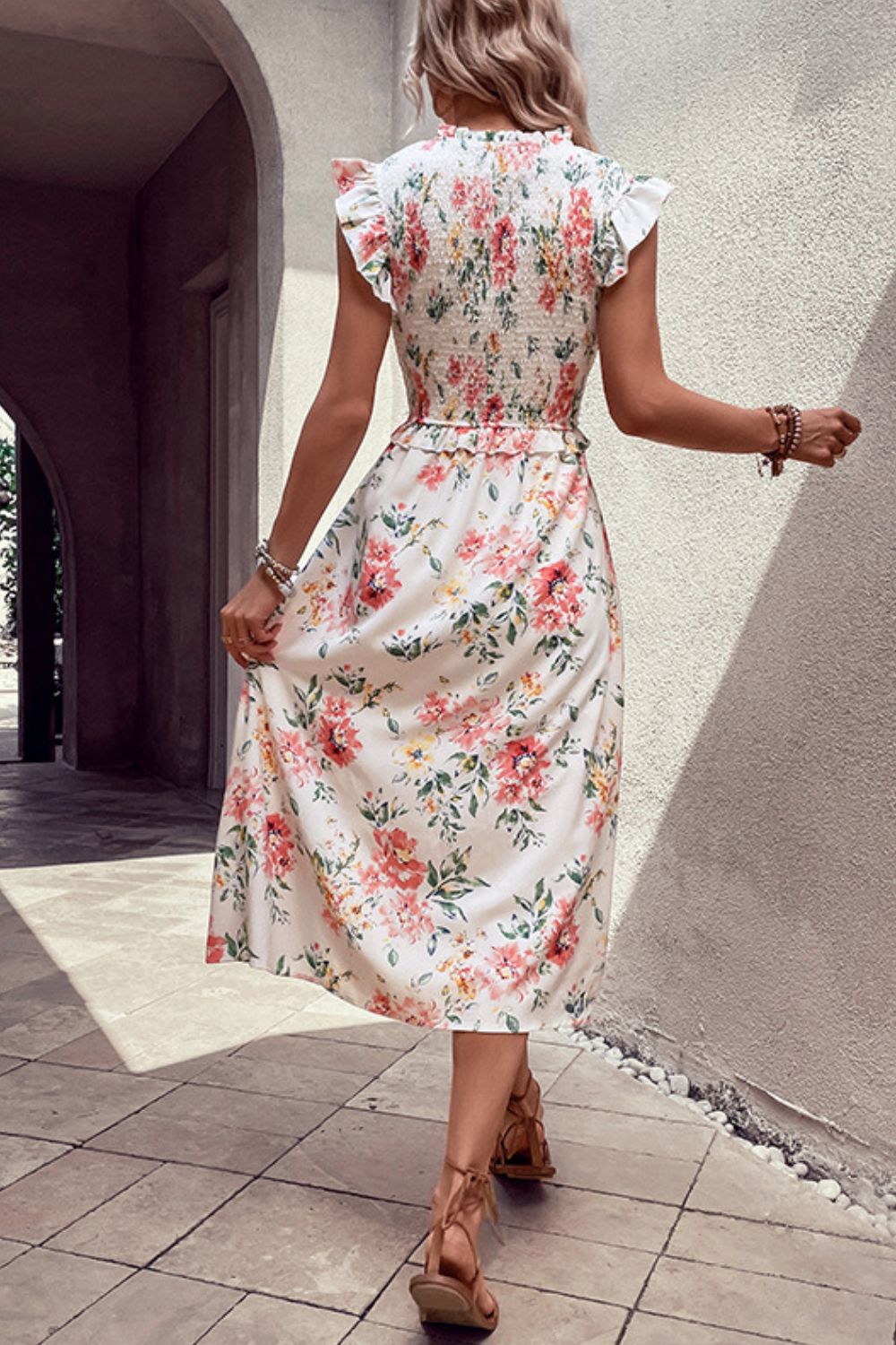 Floral smocked dress with butterfly sleeves and front slit, gathered waist, back view