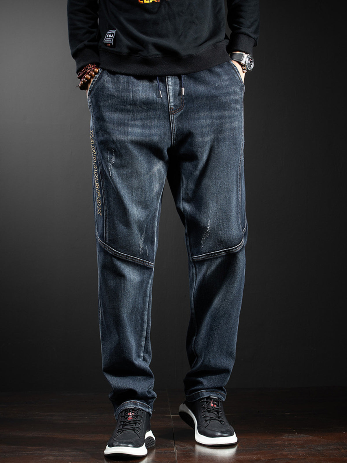 Relaxed-fit cotton jeans with stitched cargo-style side pockets, dark wash