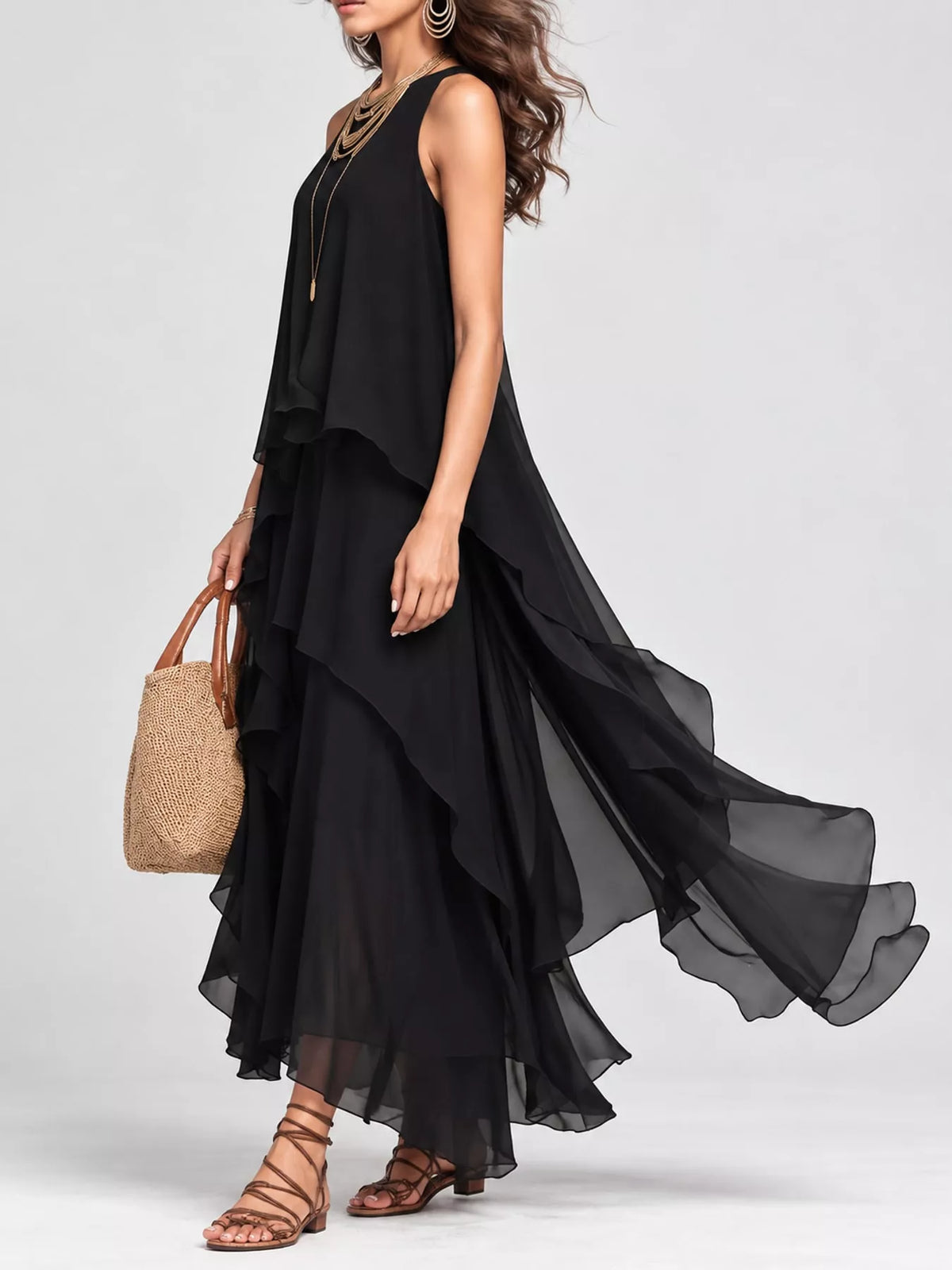 Black sleeveless ruffle maxi dress with flowing tiered skirt and armhole drape