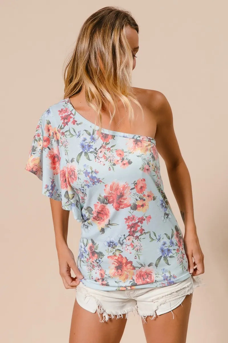 Light blue floral jersey top with one-shoulder neckline and asymmetrical ruffle sleeve