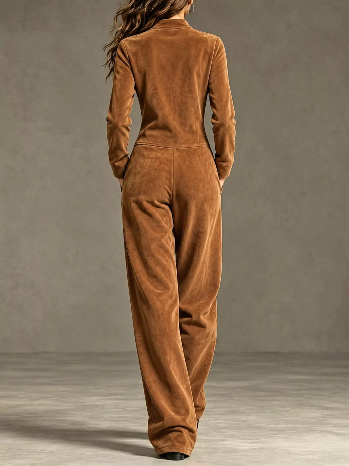 Camel brown velour zip-up jumpsuit with pockets and long sleeves, full-length back