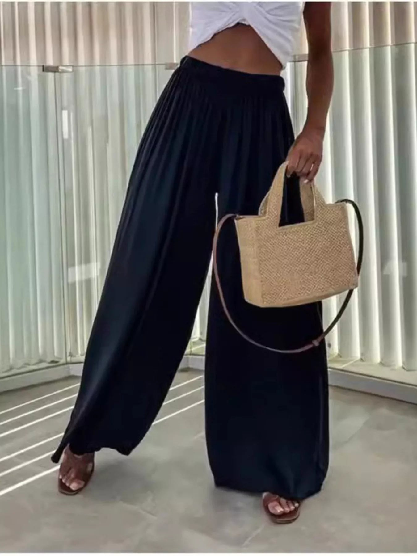 Dark navy wide-leg flowy pants with gathered waist and wide pleated legs