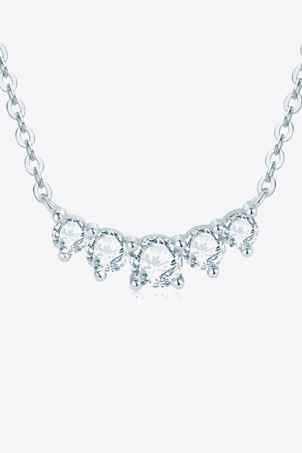 Silver pendant necklace with oval and round sparkling stones and teardrop accents