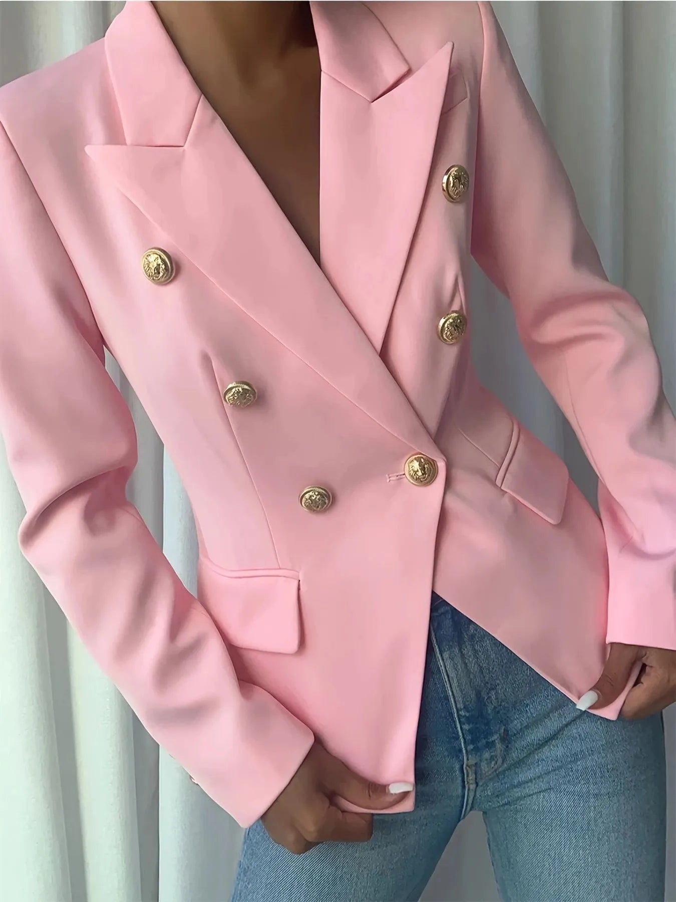 Pink lapel blazer with gold decorative buttons, structured shoulders, and front pockets