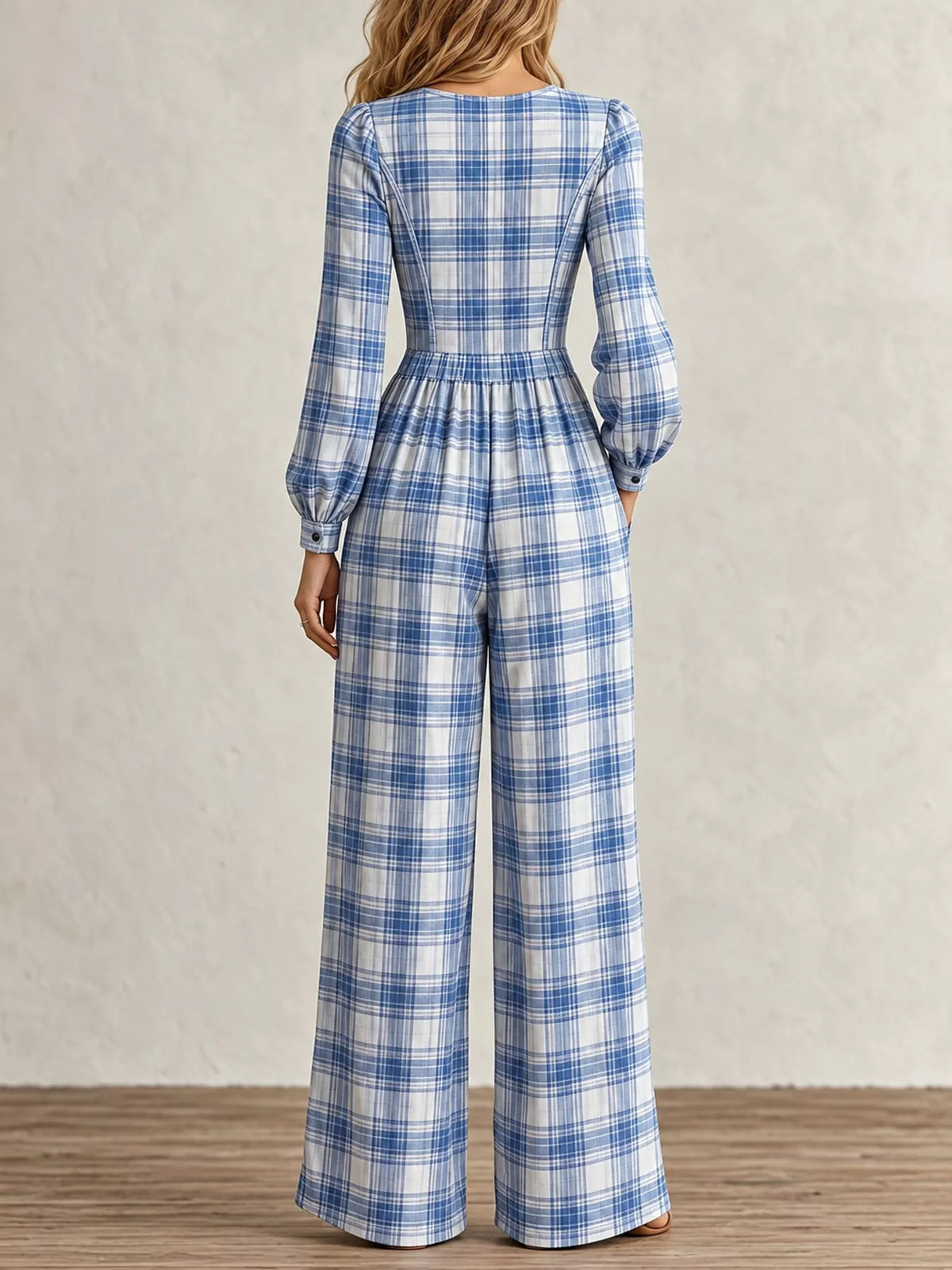 Plaid long-sleeve jumpsuit back view with gathered waist, wide legs, light blue