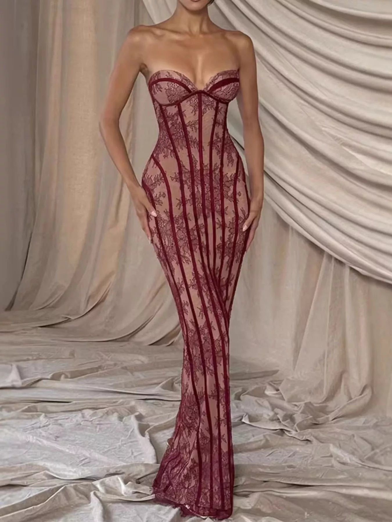 Cedar & Moore Lace Up Back Strapless Maxi Dress in burgundy lace with corset-style bodice and sheer panels