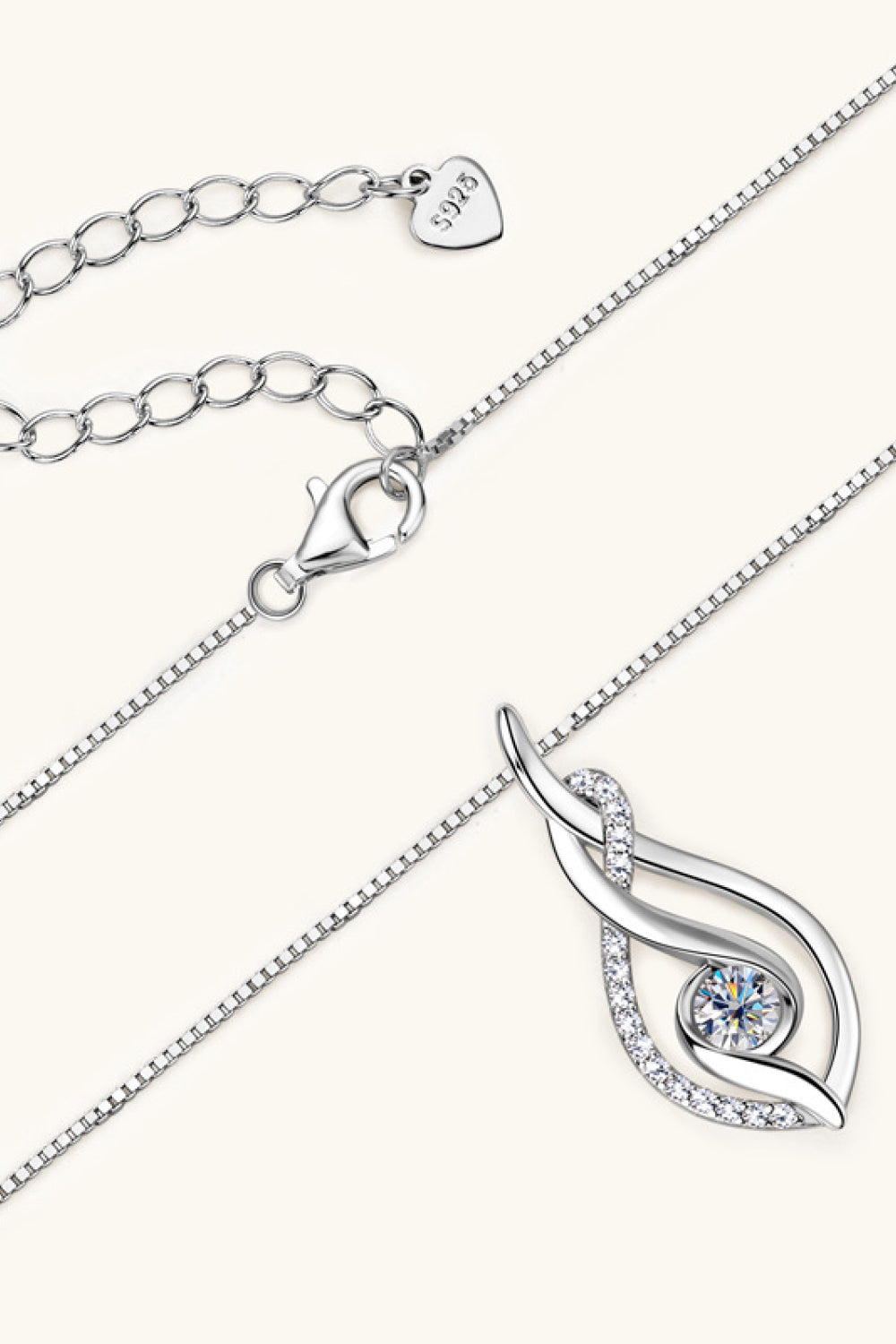 Silver moissanite necklace pendant with teardrop swirl and clasp; 925 stamp visible