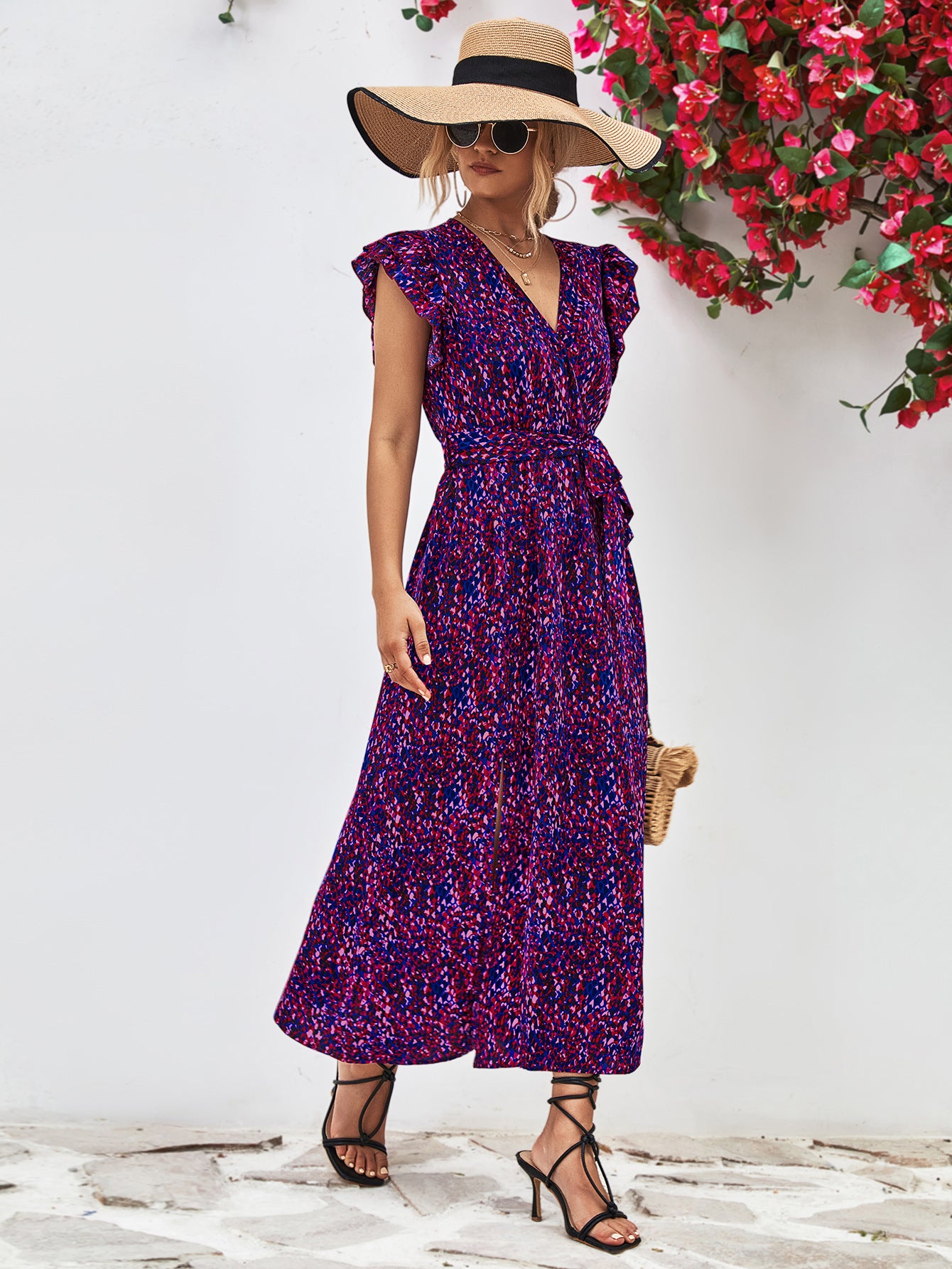 Purple printed surplice neck flutter sleeve slit dress front view, midi length with fitted waist.
