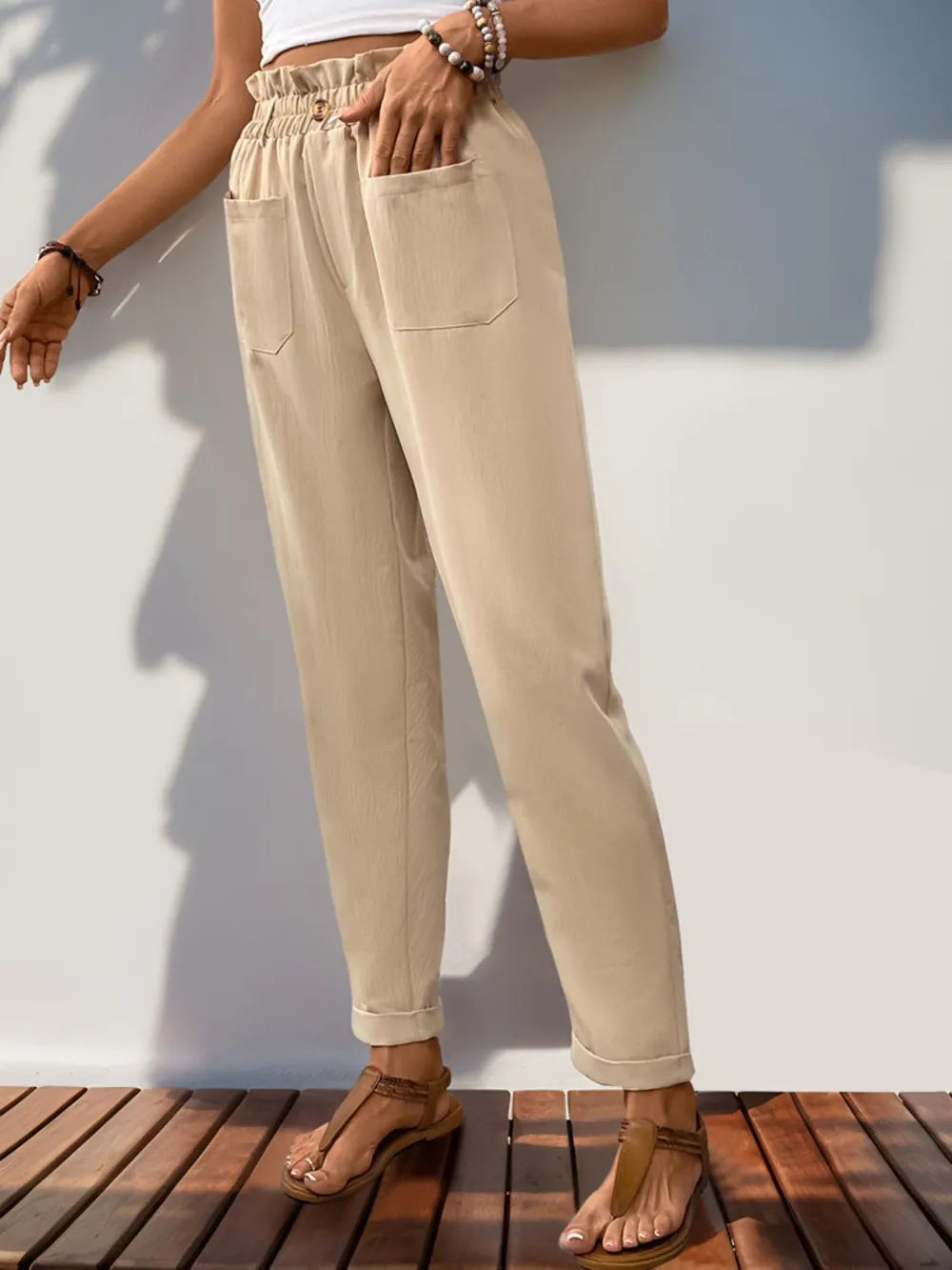 Tan high waist pants with elastic frill waistband and two side pockets
