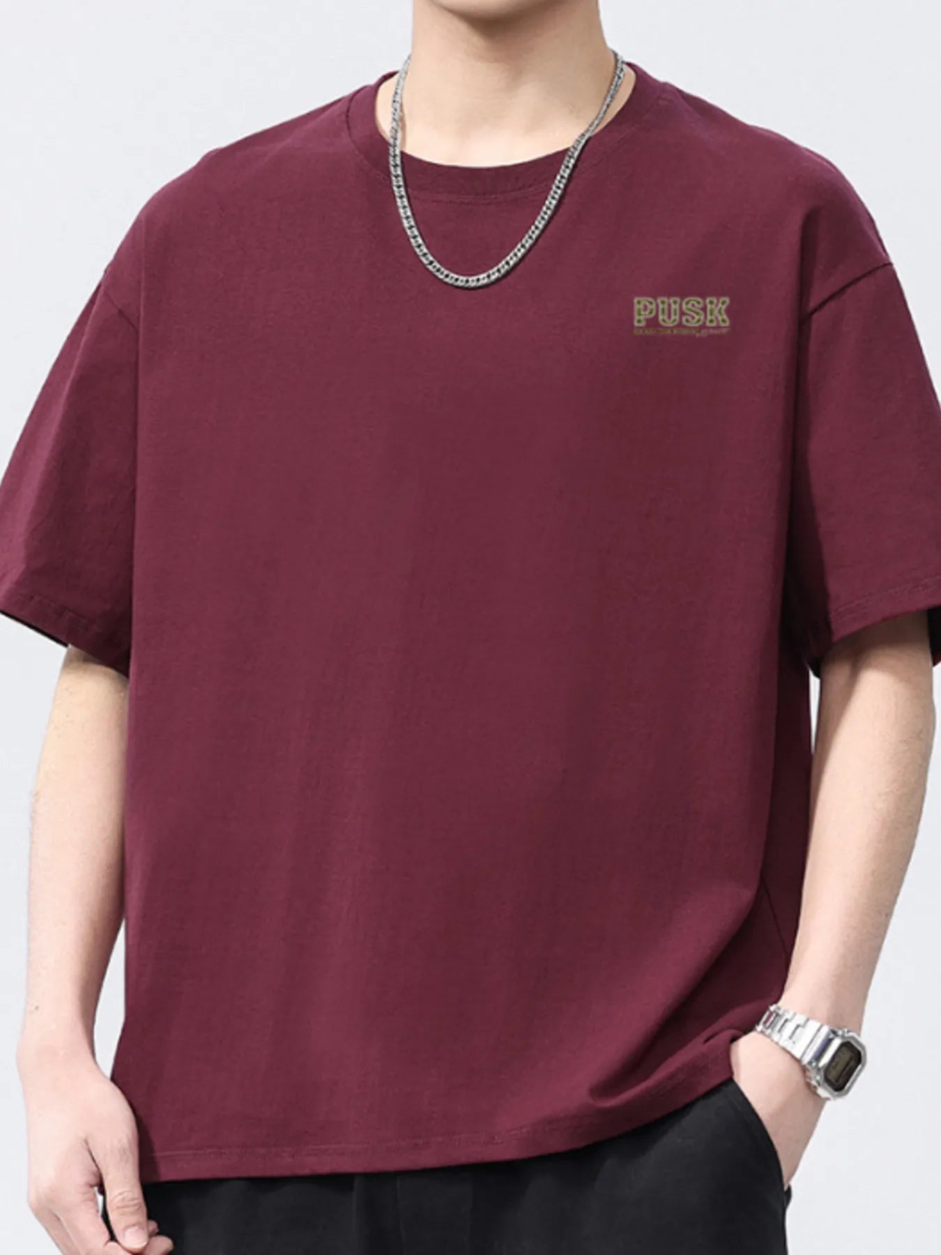 Burgundy men's short-sleeve crewneck T-shirt with small chest logo.