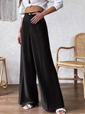 Black high-waist wide-leg trousers with button front and flowing drape