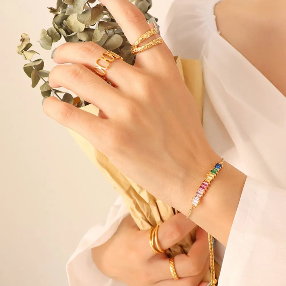 Gold-tone zircon bracelet with multicolor gem rows on a wrist
