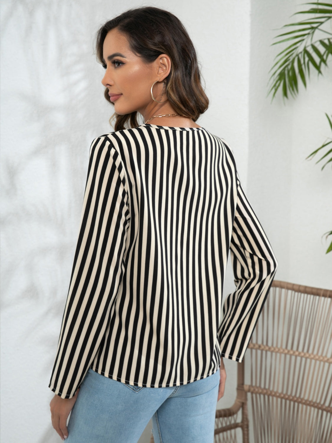 Black-and-white striped long-sleeve blouse, back view with full-length sleeves