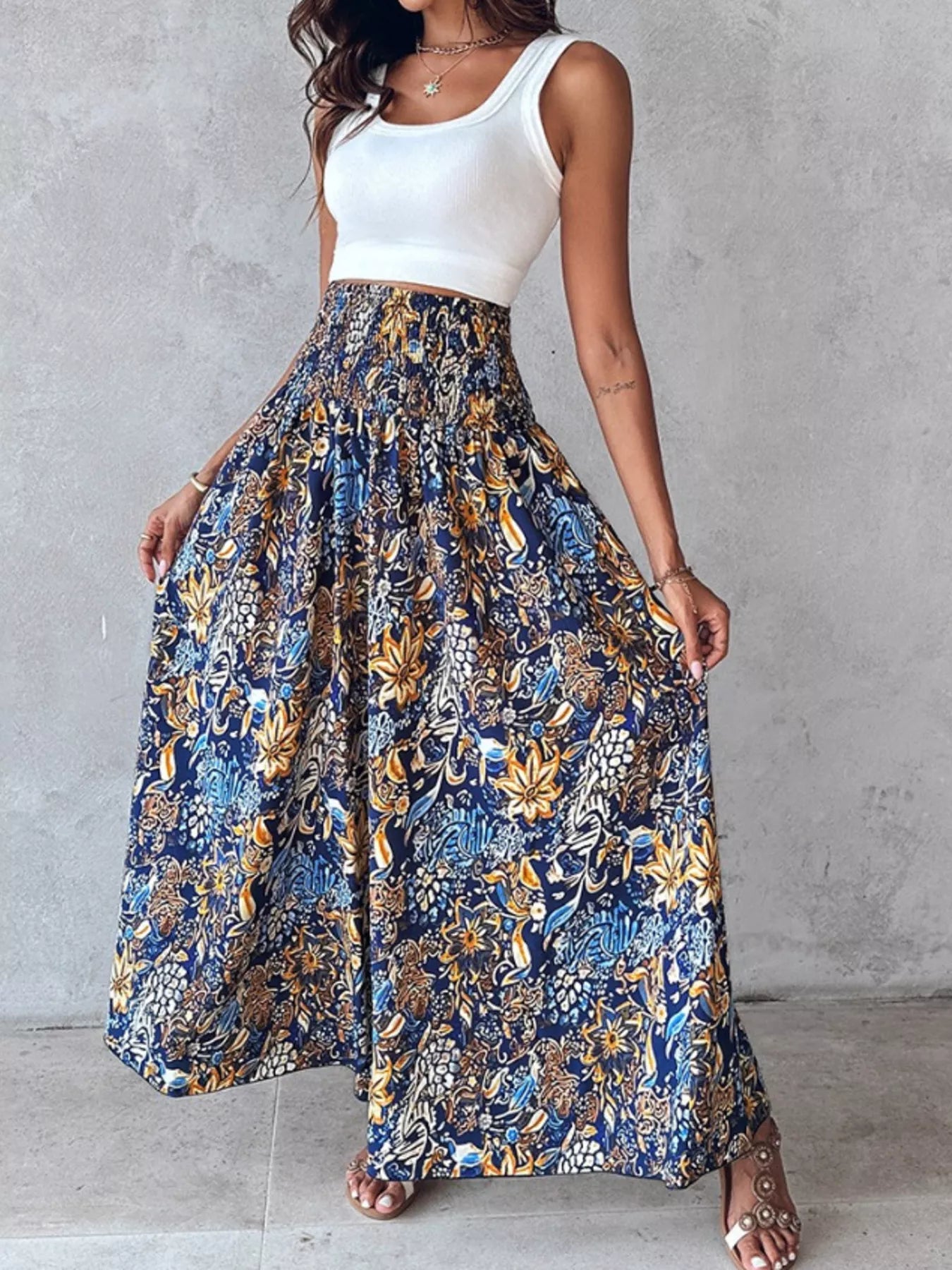 Blue printed wide-leg pants with gold floral and leaf pattern