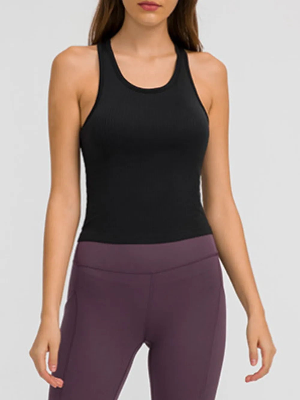 Black active tank top with round neck and racerback, smooth ribbed look