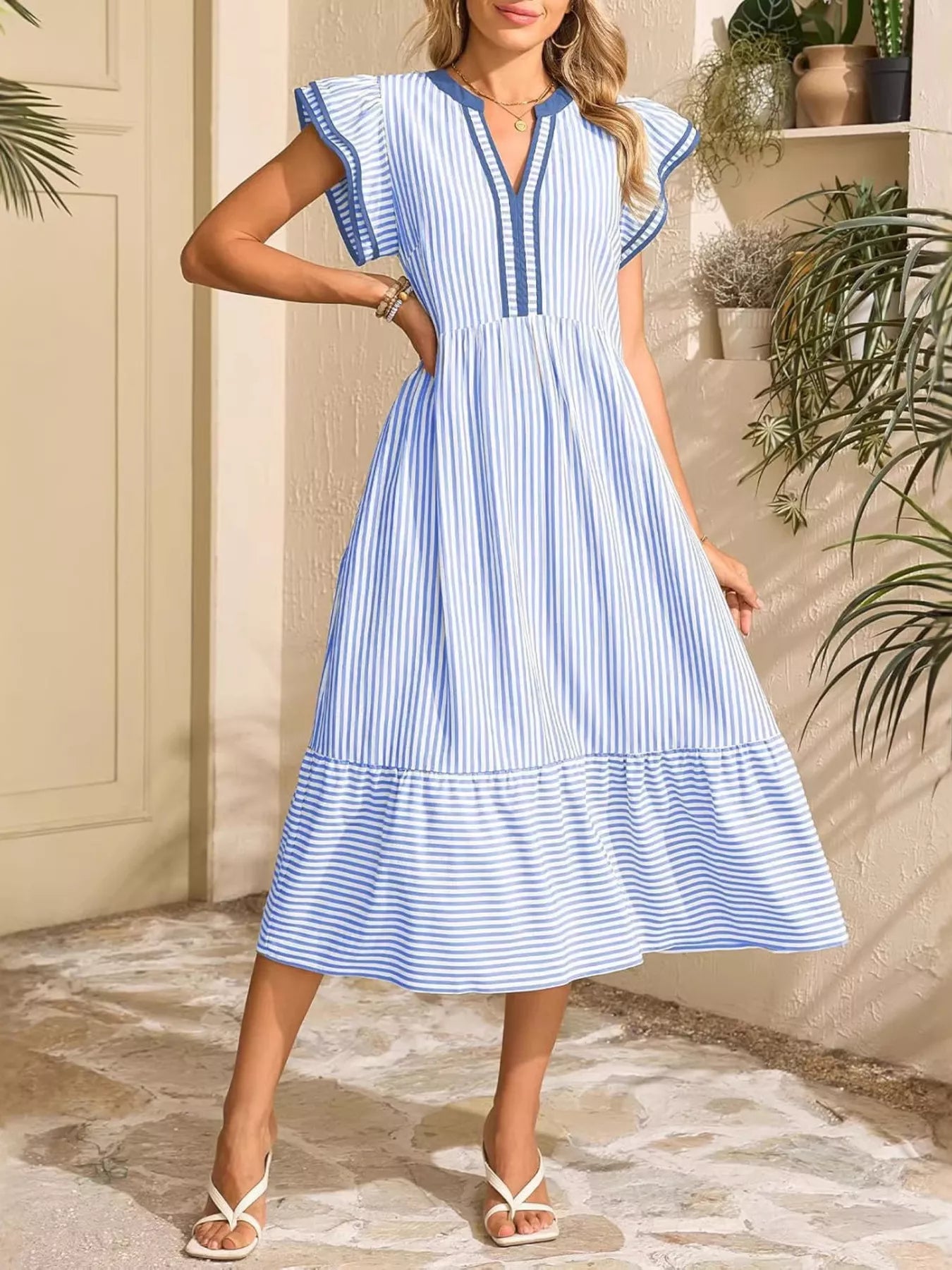 Sky blue striped midi dress with ruffle cap sleeves and V-neck; flared tiered hem