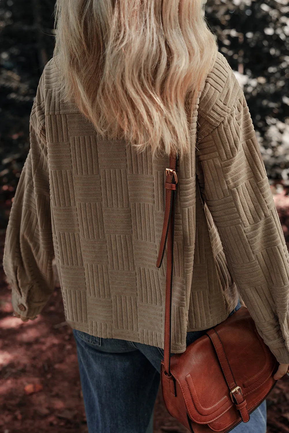 Taupe textured long-sleeve shacket with collared neckline, front pockets, side view