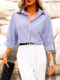 Blue and white striped button-down shirt with point collar and long sleeves