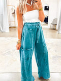 Teal mineral-wash high-waist pants with patched pockets and drawstring waist