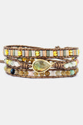 Triple-layer beaded bracelet with brown wrap, multicolor glass beads, gold accents